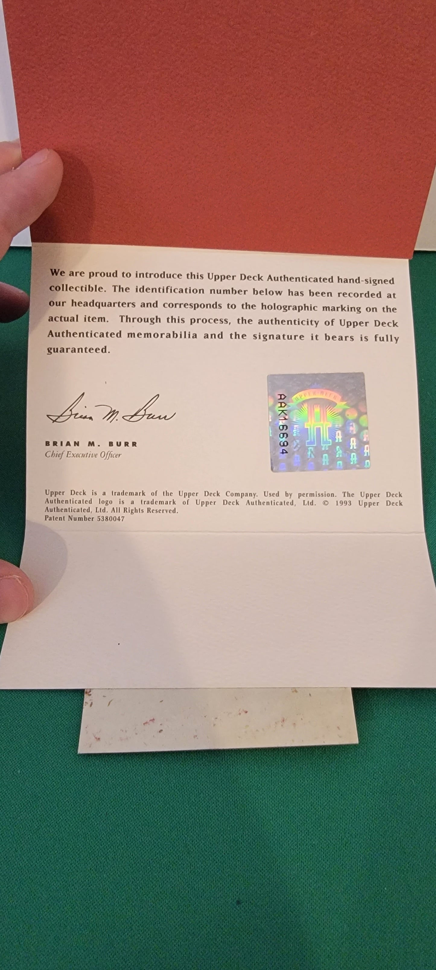 A statement of authenticity, such as a certificate of authenticity (COA) from a Upper Deck